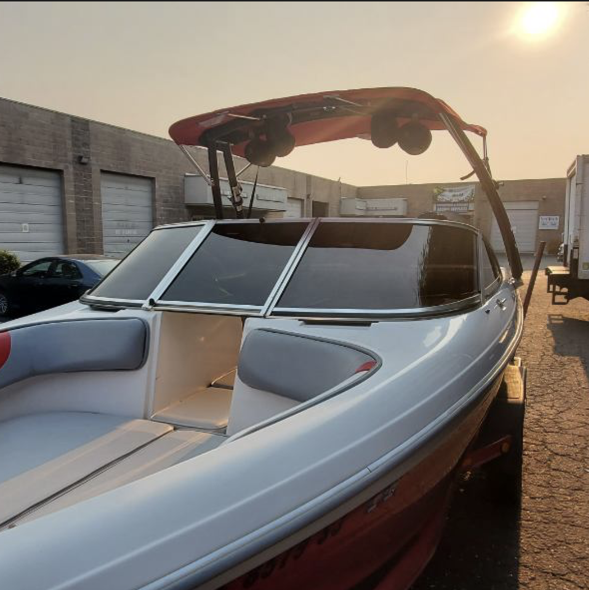 Red and white Speed boat with tinted windows