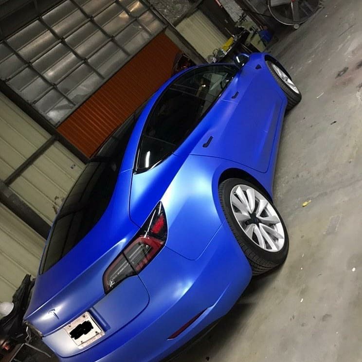 Wrapped blue tesla with ceramic window tint
