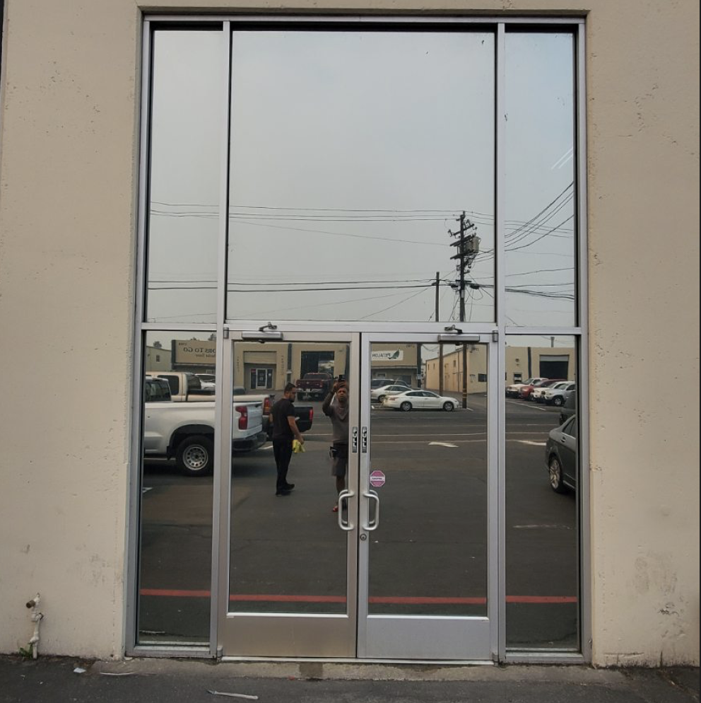 Front of a shop with its windows tinted